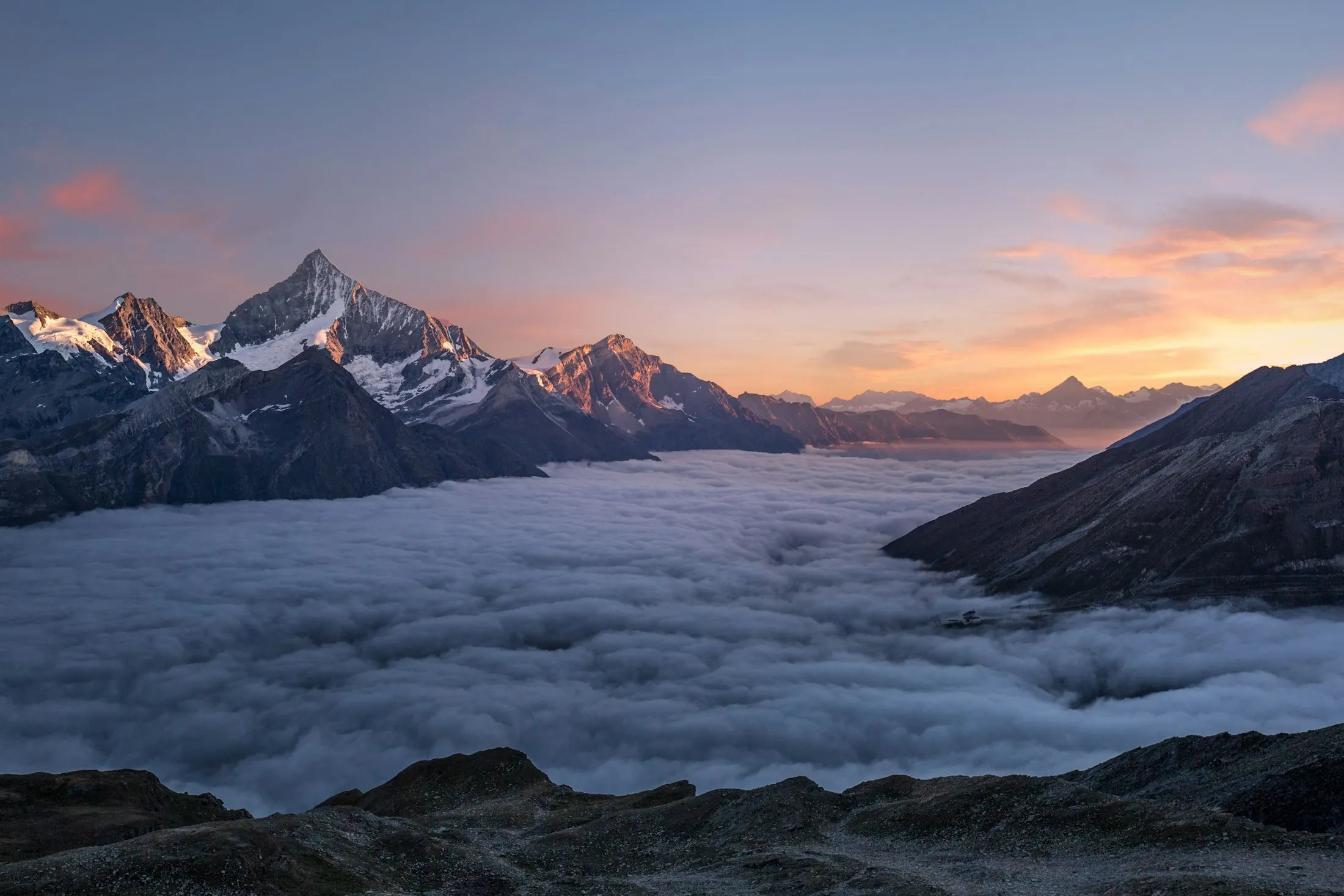 Peaks rising above a sea of clouds