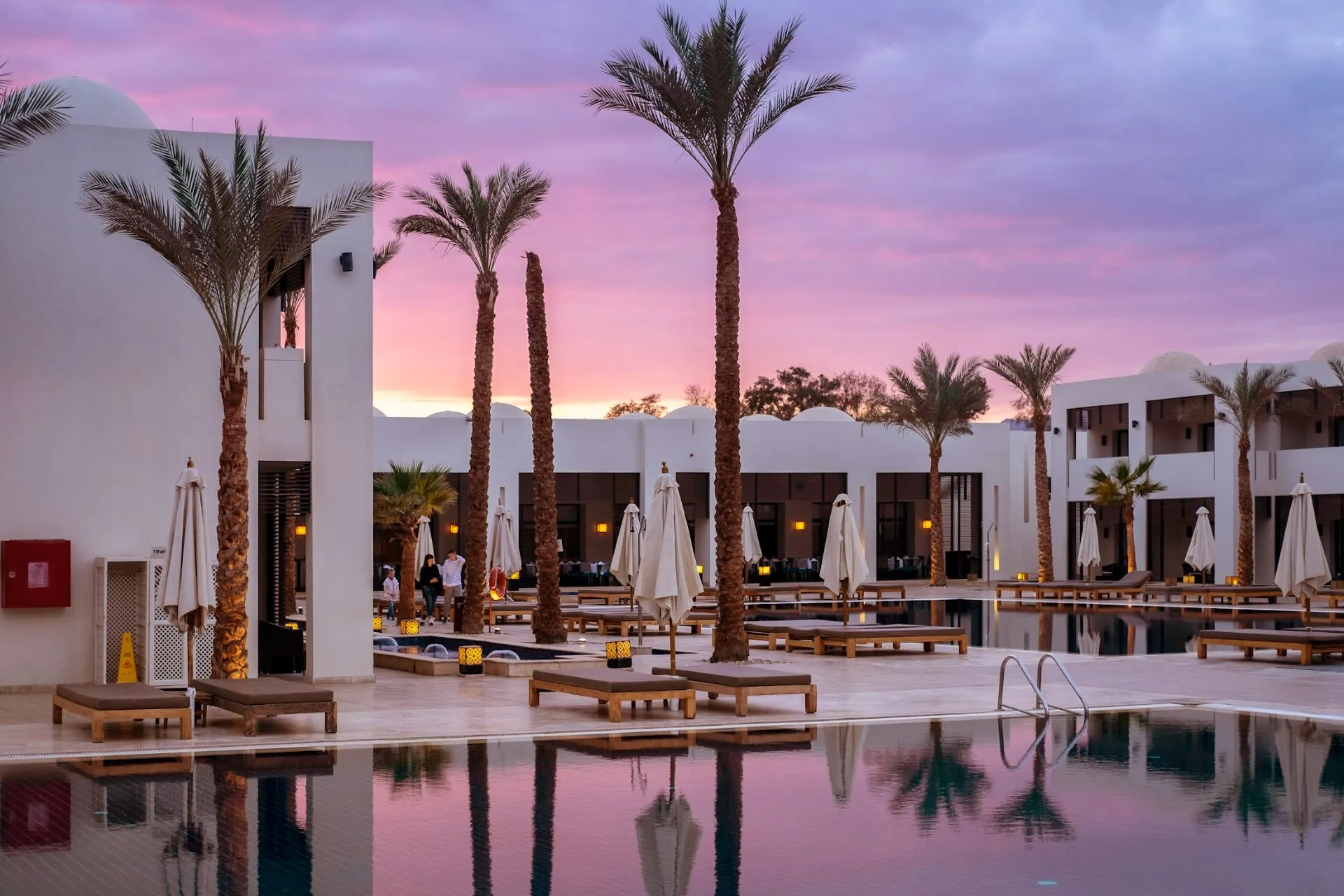 Palm courtyard and pool at Elyra resort